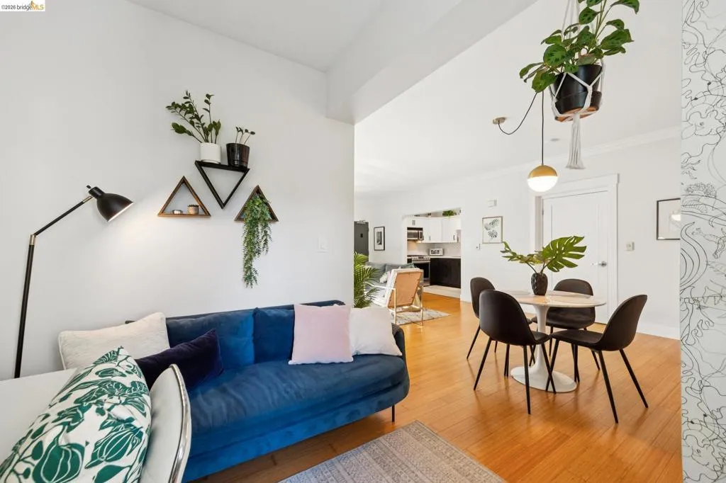 Open-concept living area with wood-finish flooring