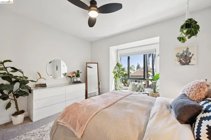 Recessed window alcove featuring a large casement window with roller blinds