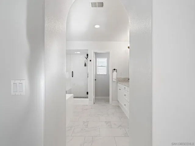 This sumptuous primary bath spa has been tastefully updated.