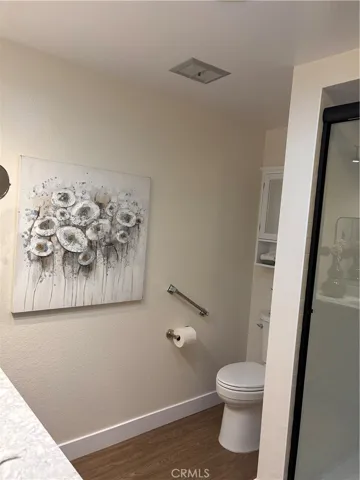 Commode with safety bar