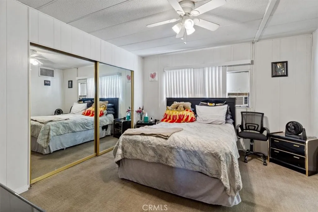 Primary Bedroom with Mirrored Closet Doors