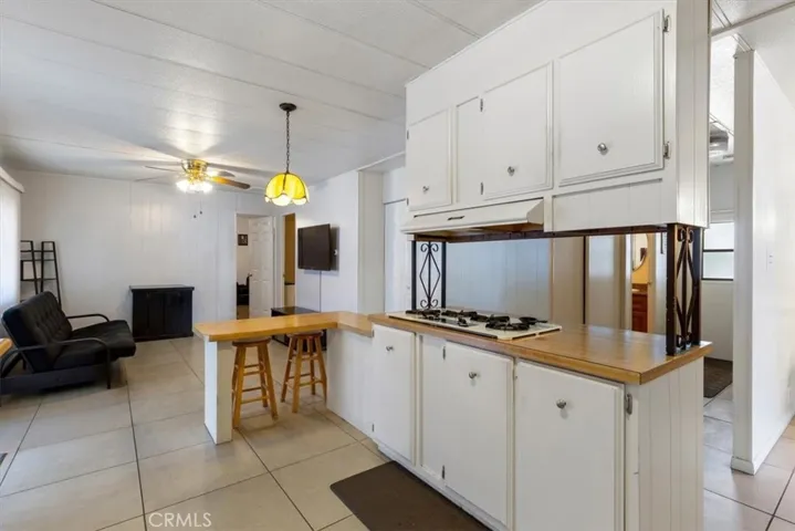 Updated Kitchen with Breakfast Bar and Ample Cabinetry