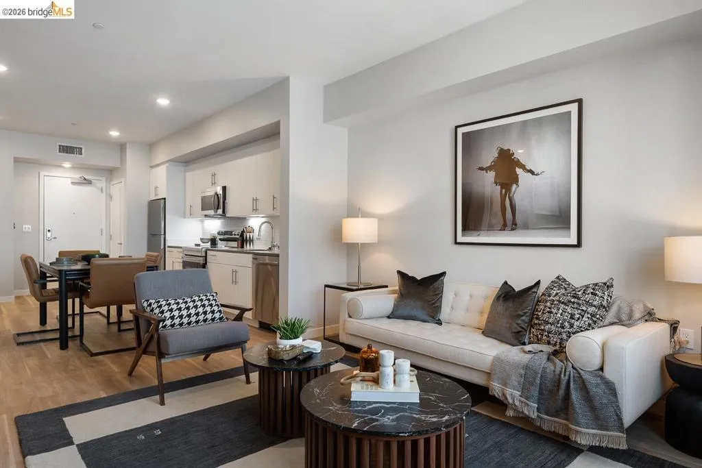 Living room featuring light wood-style floors and recessed lighting