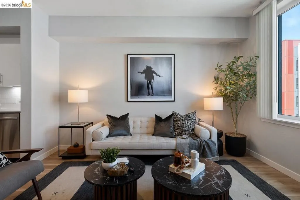 Living room featuring wood finished floors and healthy amount of natural light