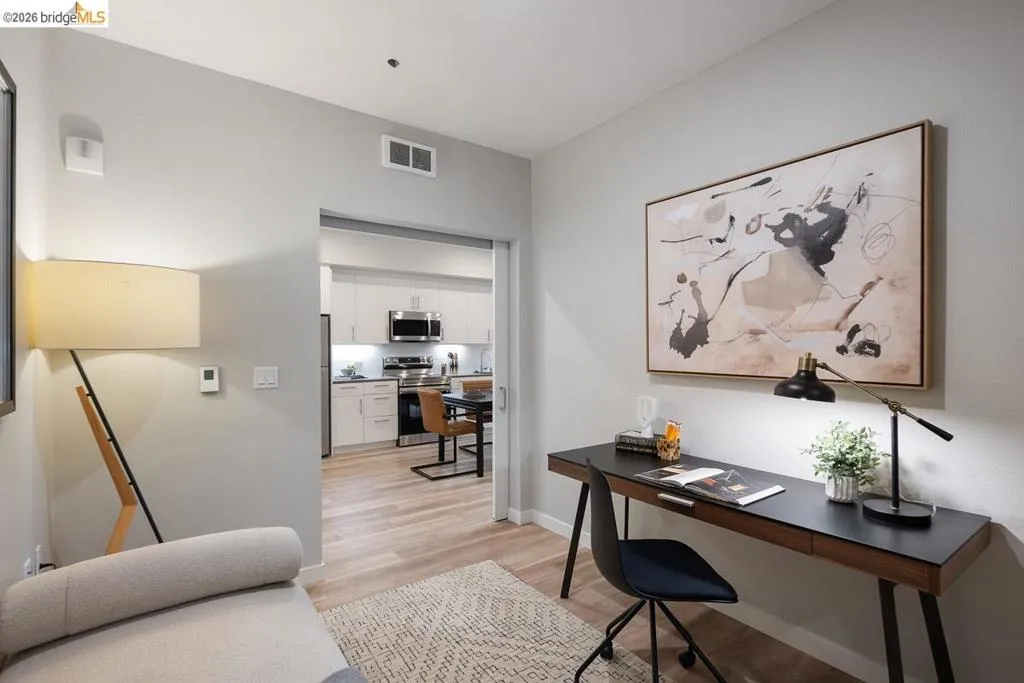 Office area with light wood-type flooring and baseboards