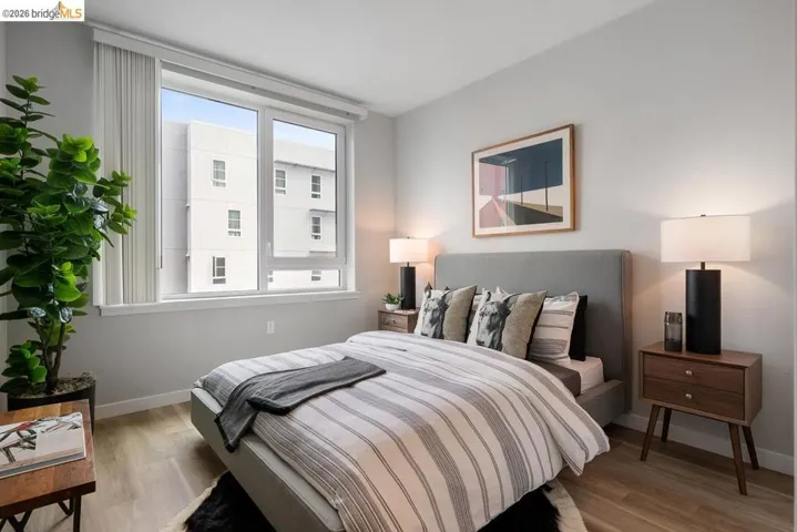 Bedroom featuring light wood-type flooring and baseboards