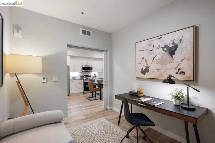Office area with light wood-type flooring and baseboards
