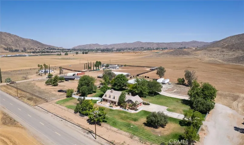 Aerial view with surrounding hills.