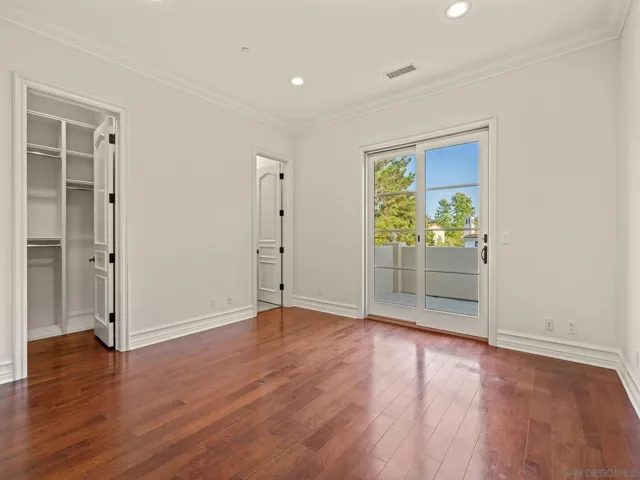 Large secondary bedroom with direct balcony access