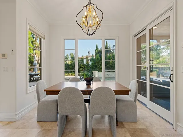 Convenient informal dining area in kitchen leads to outdoor family room.