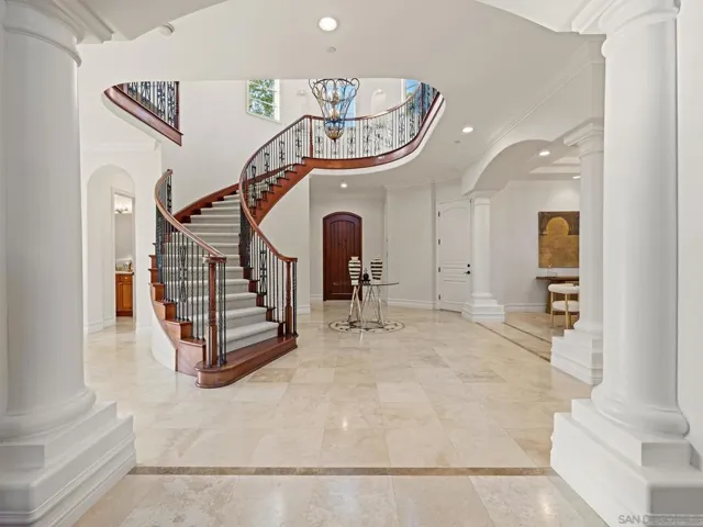 Gorgeous entry stair case and inviting foyer.
