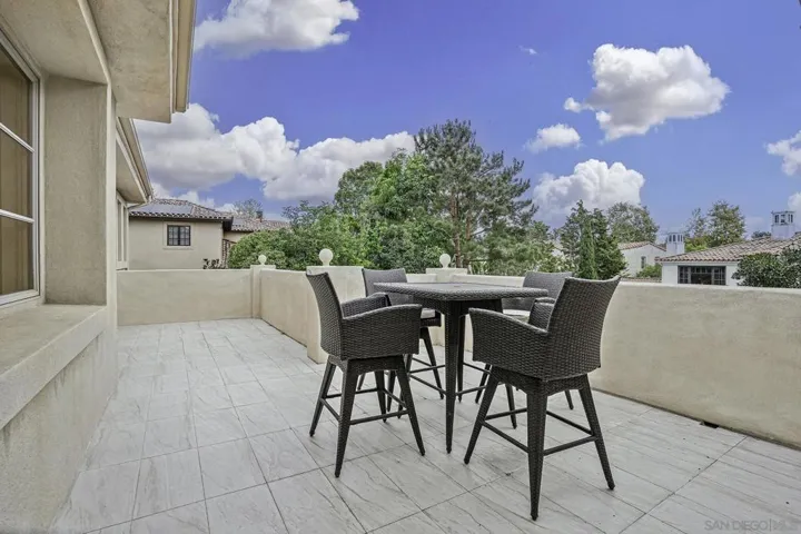 Large balcony off of primary and secondary bedroom suites, looks over your yard.