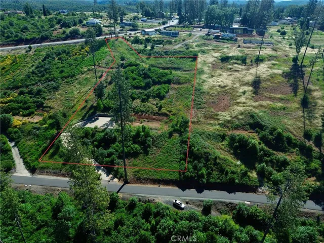 Approximate parcel boundaries shown. Nearly 1.89-acre lower Paradise homesite featuring an existing driveway, elevated building area, and peaceful canyon surroundings.
