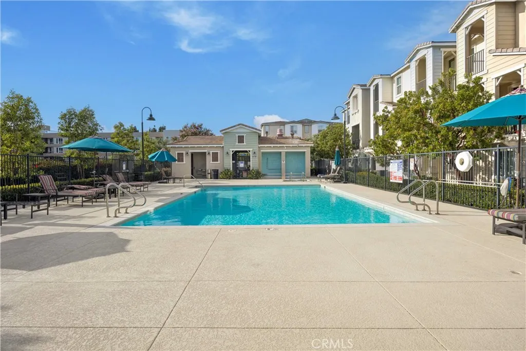 Bonita Village community pool complete with lounge chairs, shade umbrellas & convenient poolside restrooms.