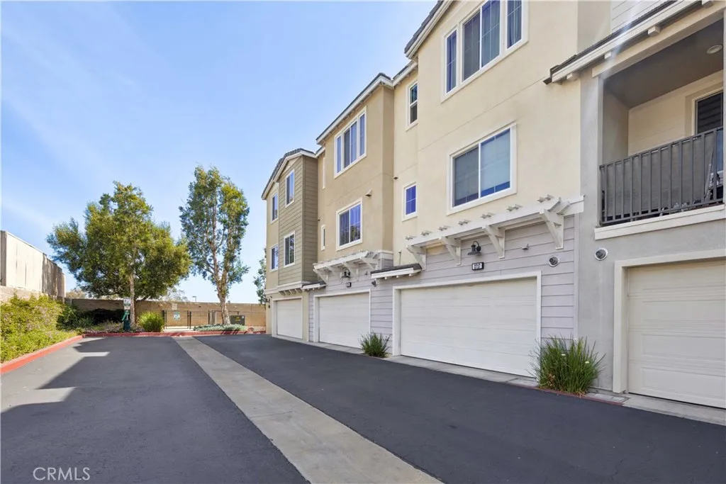 Direct-access two-car garage with wide private driveway.