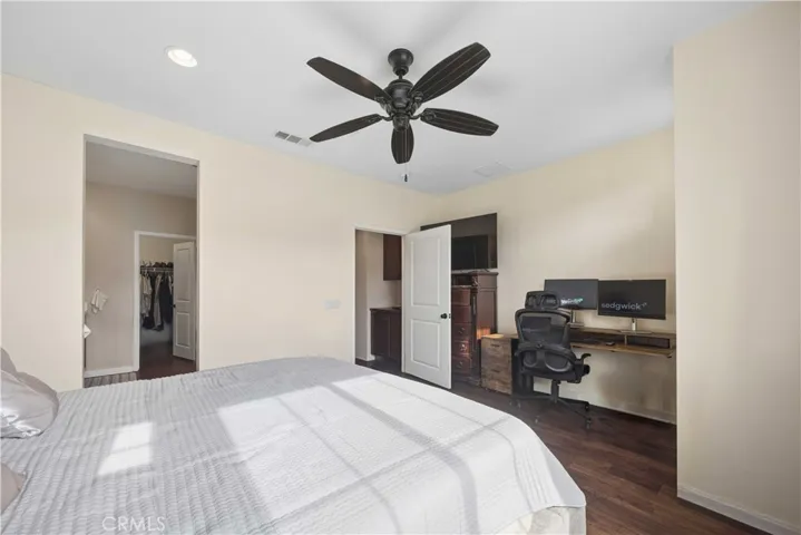 Third level primary bedroom with ample space for your home office.