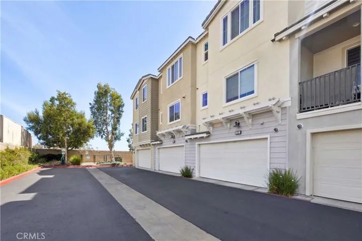 Direct-access two-car garage with wide private driveway.