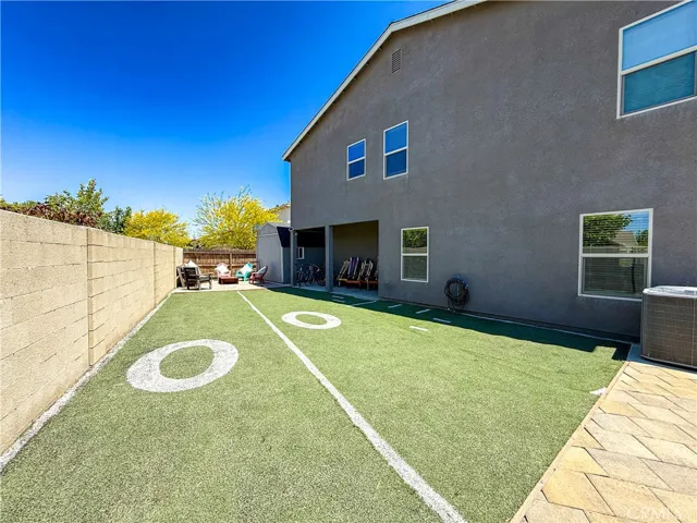 Backyard with Covered Patio and Firepit.