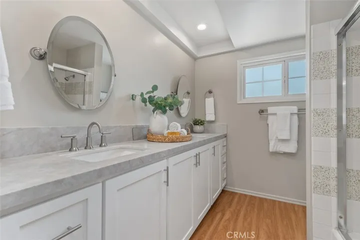 Upstairs Hall Bath with dual sinks, quartz countertops, new shaker cabinetry