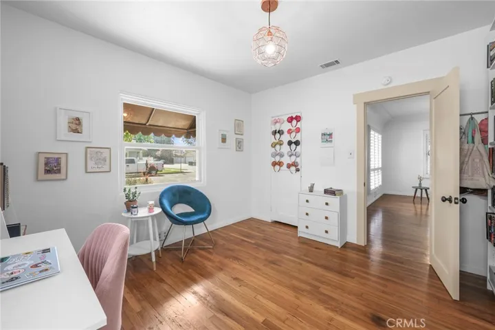 Bedroom #1 in Front with original hardwood floors