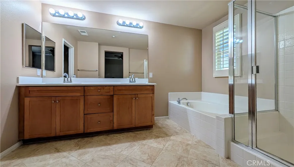 Primary en-suite bathroom with double sinks