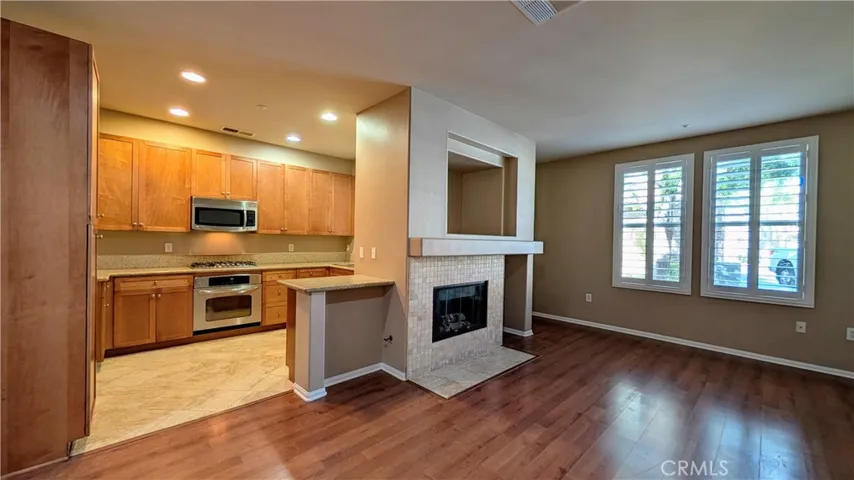 View of kitchen and living room from dining area