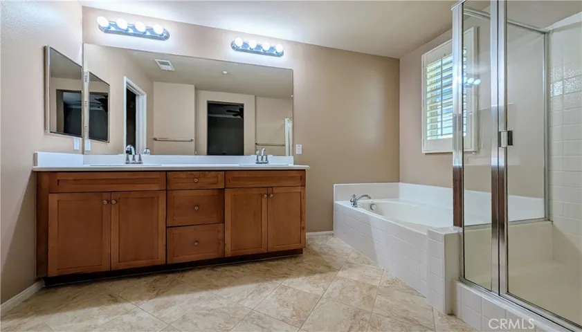 Primary en-suite bathroom with double sinks