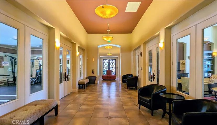 Club house corridor with view of fitness center and lounge