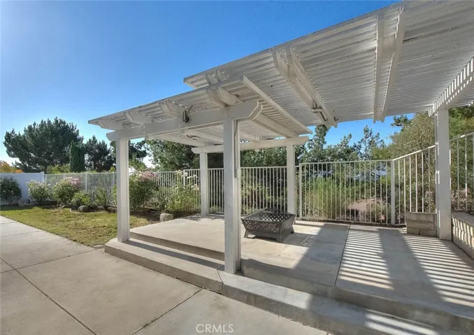 Peaceful outdoor setting underneath the pergola