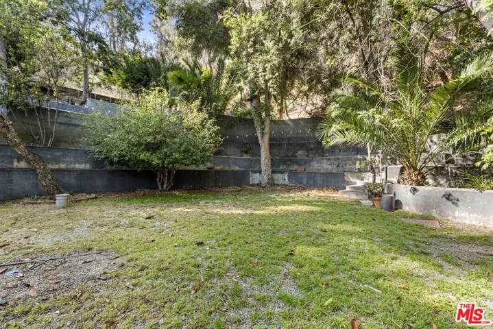 flat yard adjacent to unpaved