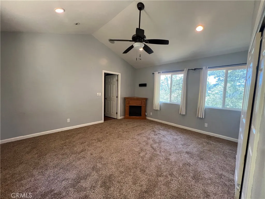Primary bedroom has new carpet and electric fireplace Primary bedroom has new carpet and electric fireplace