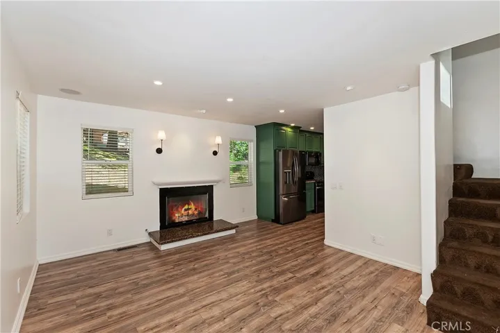 Living room with partial of stiars