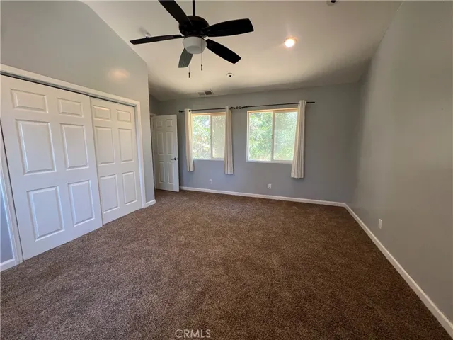 Wall of closets in primary bedroom