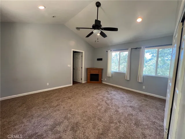 Primary bedroom has new carpet and electric fireplace