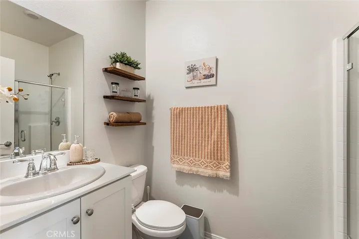 Third bathroom w/ shower in the background.