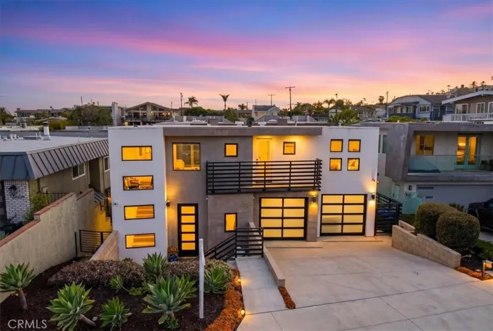 Twilight exterior view showcasing the home's striking contemporary architecture and inviting curb appeal.