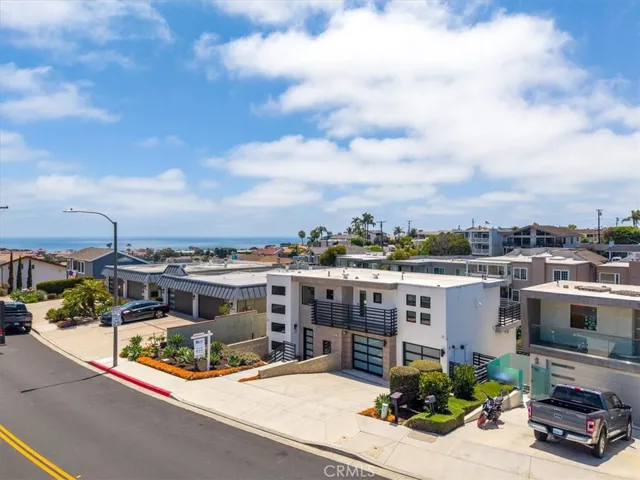Aerial neighborhood view highlighting the property's desirable location and proximity to coastal amenities.