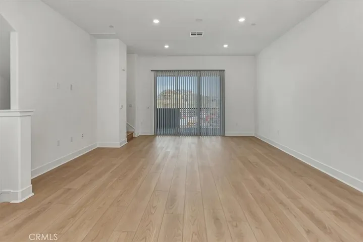 from kitchen/dining to living area and private balcony 9 three-fold slider doors