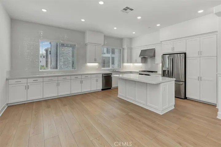 very large kitchen, GAS stovetop, island microwave, refrigerator, pull-outs in pantry, island for eat-up breakfast, plenty of storage space!