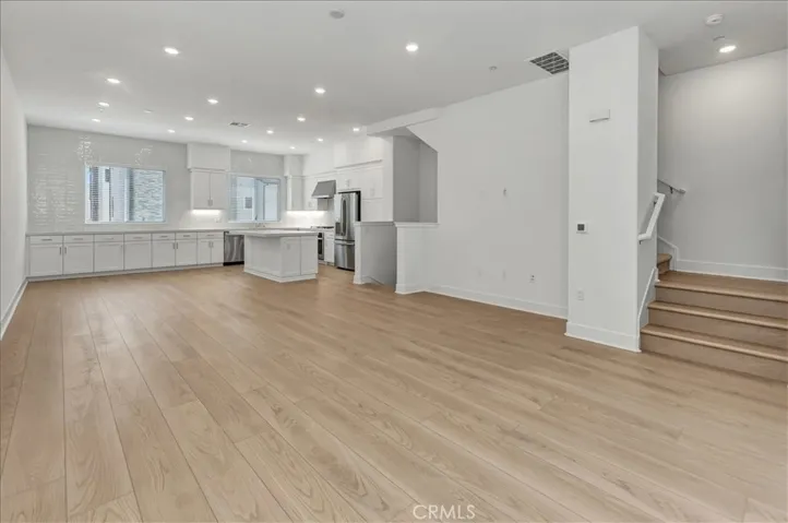 Great room for living, dining and kitchen - luxury vinyl flooring