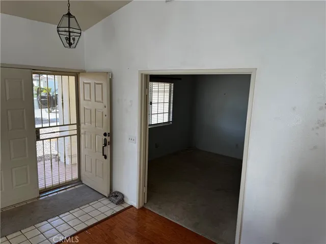 Looking entry and 1st bedroom