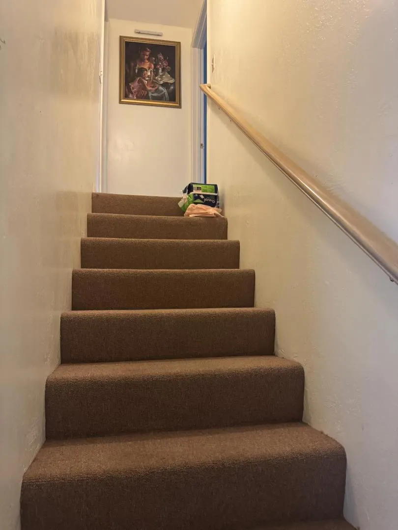 Stairs leading to attic game room