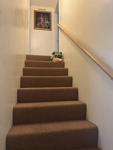 Stairs leading to attic game room