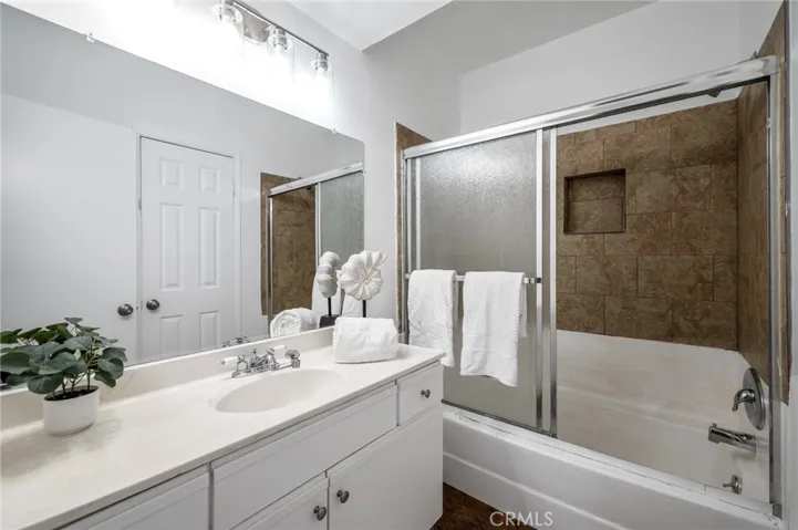 Bathroom with tub connected to Master