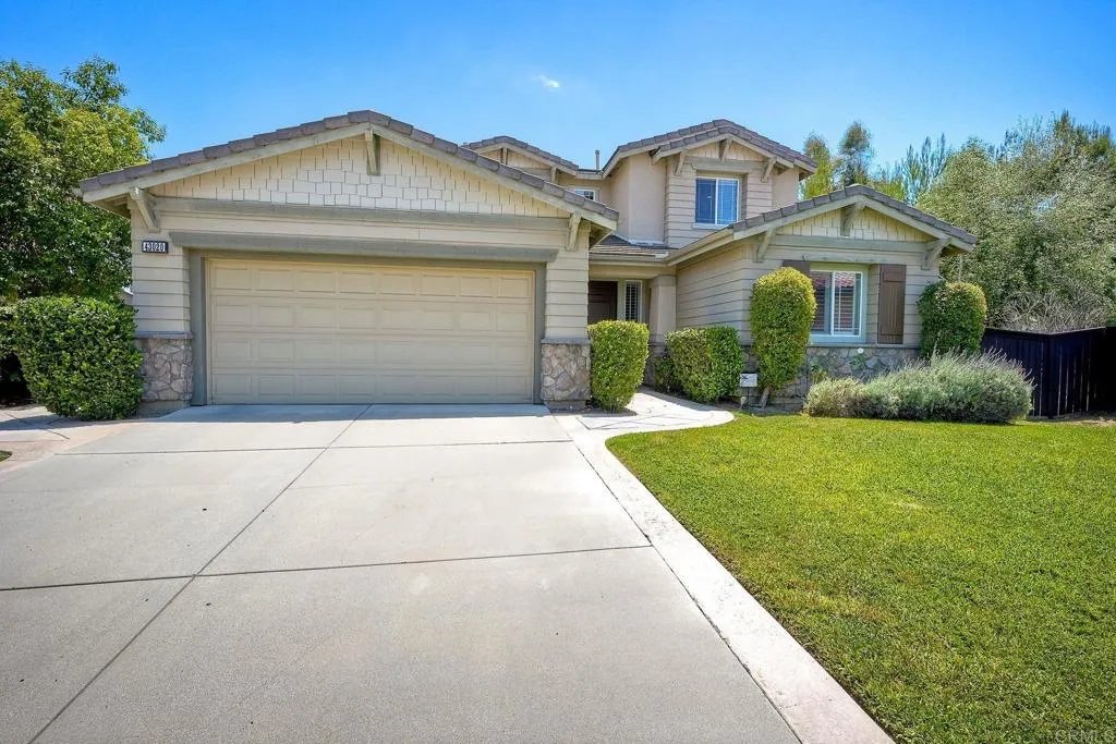 Three-car tandem garage AND plenty of driveway parking~