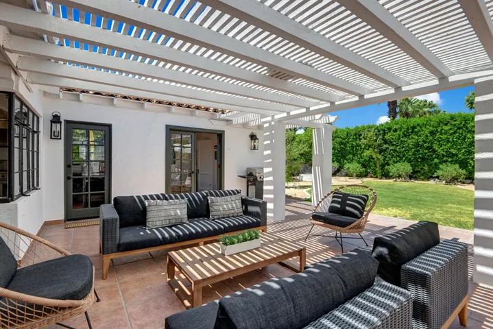 BACK COVERED PATIO THROUGH MLS