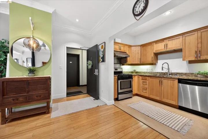 Kitchen featuring wood cabinetry and stainless steel appliances
