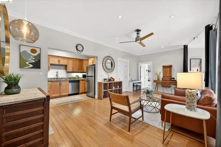 Open-concept living space with wood-finish flooring throughout