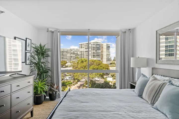 King size bed with walk and closet and en suite bathroom.