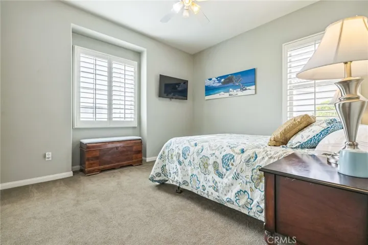 The guest bedroom gets lots of light and faces the front of the house.